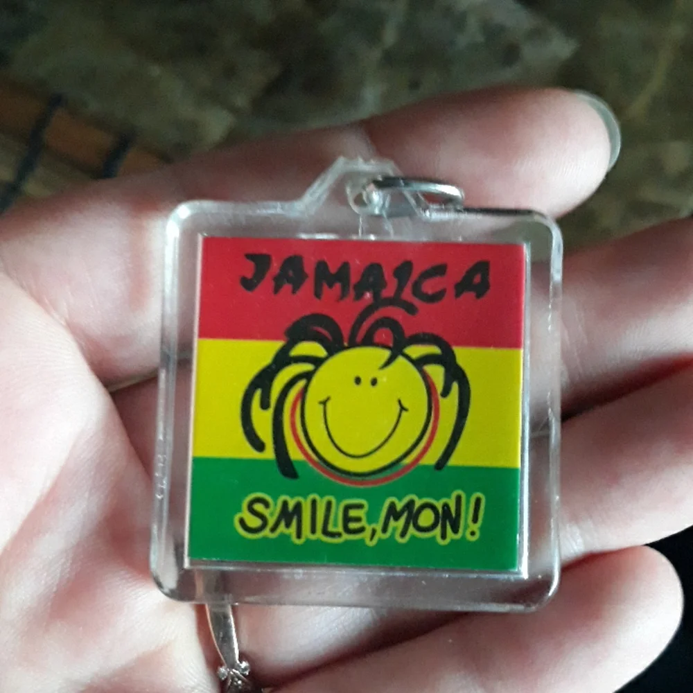 Jamaica Smile, Mon! Keychain. 1.5 inches by 1.5 inches plastic with metal ring